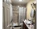Well-lit bathroom featuring a tiled shower/tub and a double sink vanity providing ample space at , Indianapolis, IN 46241