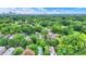 Overhead view of a neighborhood with mature trees, showcasing the diverse architecture and serene environment at 1338 N Parker Ave, Indianapolis, IN 46201