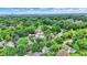 Lush aerial view of a neighborhood, highlighting tree-lined streets and a variety of charming homes at 1338 N Parker Ave, Indianapolis, IN 46201