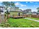 Backyard featuring lawn, deck, and fence at 1338 N Parker Ave, Indianapolis, IN 46201