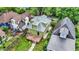 Aerial view of a backyard with a wooden deck, surrounded by a lush green yard at 1338 N Parker Ave, Indianapolis, IN 46201