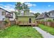 Backyard view showing deck, fence, and lawn at 1338 N Parker Ave, Indianapolis, IN 46201