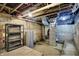 Unfinished basement showcasing utilities, exposed ceiling, and concrete floor at 1338 N Parker Ave, Indianapolis, IN 46201