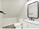 Bathroom showcases a modern vanity with marble countertop and a black framed mirror, adding a touch of elegance at 1338 N Parker Ave, Indianapolis, IN 46201