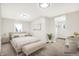 Bedroom staged with bed, bench, and desk, bathed in natural light, creating a bright and inviting space at 1338 N Parker Ave, Indianapolis, IN 46201