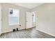 Bright, empty bedroom shows flooring and natural light at 1338 N Parker Ave, Indianapolis, IN 46201