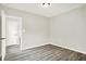 Vacant bedroom features wood-look floors and neutral colored walls at 1338 N Parker Ave, Indianapolis, IN 46201