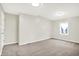 The bedroom offers a calming retreat with neutral walls, soft carpeting, and a bright window, enhancing the inviting space at 1338 N Parker Ave, Indianapolis, IN 46201