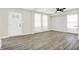 Bright living room featuring elegant, light gray walls, wood-look floors, and ample natural light at 1338 N Parker Ave, Indianapolis, IN 46201