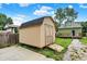 Backyard shed with double doors on a sunny day at 1338 N Parker Ave, Indianapolis, IN 46201