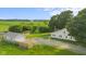 A beautiful aerial view of this home and its surrounding acreage and outbuildings at 14855 E State Road 46, Columbus, IN 47203