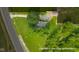 An aerial view shows this property's location among roads, fields, and forests at 14855 E State Road 46, Columbus, IN 47203