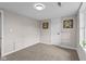 Cozy bedroom with carpeted floors, neutral walls and a sunny window at 14855 E State Road 46, Columbus, IN 47203