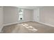 Cozy bedroom with neutral carpet and paint and lots of natural light at 14855 E State Road 46, Columbus, IN 47203