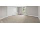 Empty bedroom featuring neutral carpet and closet at 14855 E State Road 46, Columbus, IN 47203
