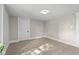 This bedroom boasts neutral paint, carpet, and a modern light fixture at 14855 E State Road 46, Columbus, IN 47203