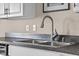 Close-up of stainless steel sink and faucet with countertops at 14855 E State Road 46, Columbus, IN 47203