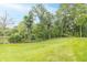 Beautiful backyard featuring a well-maintained lawn and a charming gazebo for relaxation at 1497 N 200 W, Greenfield, IN 46140