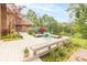 Large backyard deck with seating area, mature trees and landscaping provide an amazing view at 1497 N 200 W, Greenfield, IN 46140
