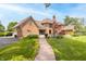 Outdoor living: Brick home showcases an expansive backyard, patio, and lush landscaping perfect for entertaining and relaxation at 1497 N 200 W, Greenfield, IN 46140