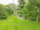 Lush backyard featuring manicured lawn and serene river views, perfect for outdoor enjoyment at 1497 N 200 W, Greenfield, IN 46140