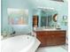 Well-appointed bathroom featuring a soaking tub, updated vanity, and natural light at 1497 N 200 W, Greenfield, IN 46140