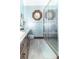 Modern bathroom with walk-in shower, stylish vanity, and updated fixtures at 1497 N 200 W, Greenfield, IN 46140