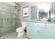 Stylish bathroom with a glass door shower and light blue vanity with ample storage at 1497 N 200 W, Greenfield, IN 46140