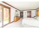 Serene bedroom with sliding glass doors, wooden dresser, and a neutral color palette at 1497 N 200 W, Greenfield, IN 46140