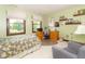 Spacious bedroom with ample natural light, featuring a study area and comfortable armchair at 1497 N 200 W, Greenfield, IN 46140