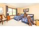 Bedroom featuring two beds with blue patterned bedding and a window with natural light at 1497 N 200 W, Greenfield, IN 46140