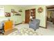 This bedroom features soothing green walls, built-in shelves, and a comfortable reading nook at 1497 N 200 W, Greenfield, IN 46140