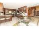 Light-filled breakfast nook featuring a glass table and stylish chairs next to the kitchen at 1497 N 200 W, Greenfield, IN 46140