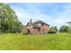 Spacious brick home with a well-manicured lawn, offering a perfect blend of comfort and style at 1497 N 200 W, Greenfield, IN 46140