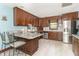 Updated kitchen features granite countertops, stainless steel appliances, and ample cabinet space at 1497 N 200 W, Greenfield, IN 46140