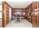 Elegant home office with wood paneling, built-in shelves, and ample natural light at 1497 N 200 W, Greenfield, IN 46140