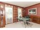 Functional home office featuring a modern desk, large windows, and comfortable seating at 1497 N 200 W, Greenfield, IN 46140