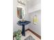 Stylish powder room with a unique vessel sink, decorative mirror, and tiled floor at 1497 N 200 W, Greenfield, IN 46140