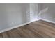 This bedroom features wood-look flooring, painted walls and trim at 1501 California St, Columbus, IN 47201