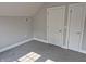 Bright bedroom showcasing modern gray carpet and trim with a closet at 1501 California St, Columbus, IN 47201
