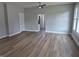 Bright living room with beautiful wood flooring, neutral walls, and ample natural light at 1501 California St, Columbus, IN 47201
