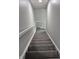 Carpeted staircase with a white railing, leading to the upper floors of the house at 1501 California St, Columbus, IN 47201