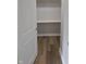 This walk-in closet features wood-look flooring and painted walls and trim at 1501 California St, Columbus, IN 47201