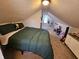 Sloped ceilings and carpeted floors create this cute attic bedroom area at 1510 Chester St, Anderson, IN 46012