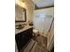 Cozy bathroom with decorative shower curtain, vanity, and modern fixtures at 1510 Chester St, Anderson, IN 46012