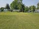 Home with a large grassy yard and mature trees at 1510 Chester St, Anderson, IN 46012