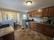 Efficient kitchen has stainless steel appliances, wooden cabinets and eat-in breakfast nook at 1510 Chester St, Anderson, IN 46012