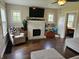 This inviting living room offers a white brick fireplace and comfortable seating at 1510 Chester St, Anderson, IN 46012