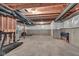 Unfinished basement space showing the concrete floor and exposed wooden ceiling beams at 15359 Manning Way, Westfield, IN 46074