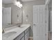 Bathroom vanity with double sinks, modern fixtures, and door to bathroom at 15359 Manning Way, Westfield, IN 46074